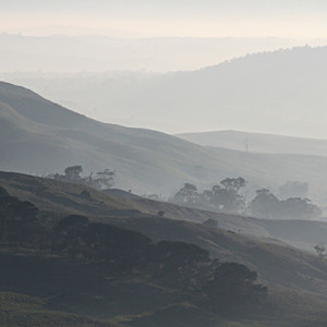 One of the handy features of shooting with a telephoto lens is that perspective is flattened. This can be used for creative purposes in flattening scenery into semi-abstract patterns.